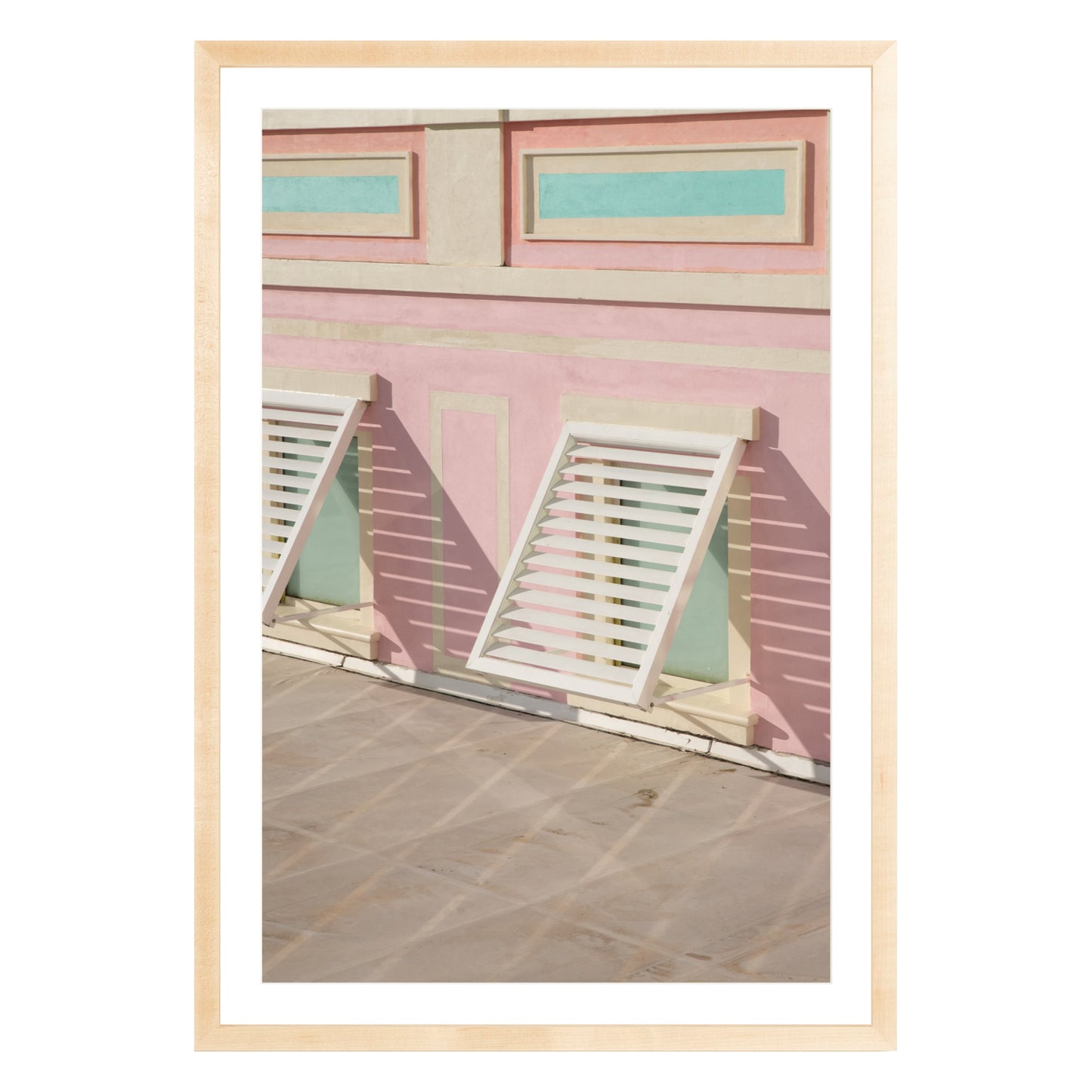 Photograph of colorful geometric building with open window shades in Baha Mar, Bahamas framed in natural wood with white mat