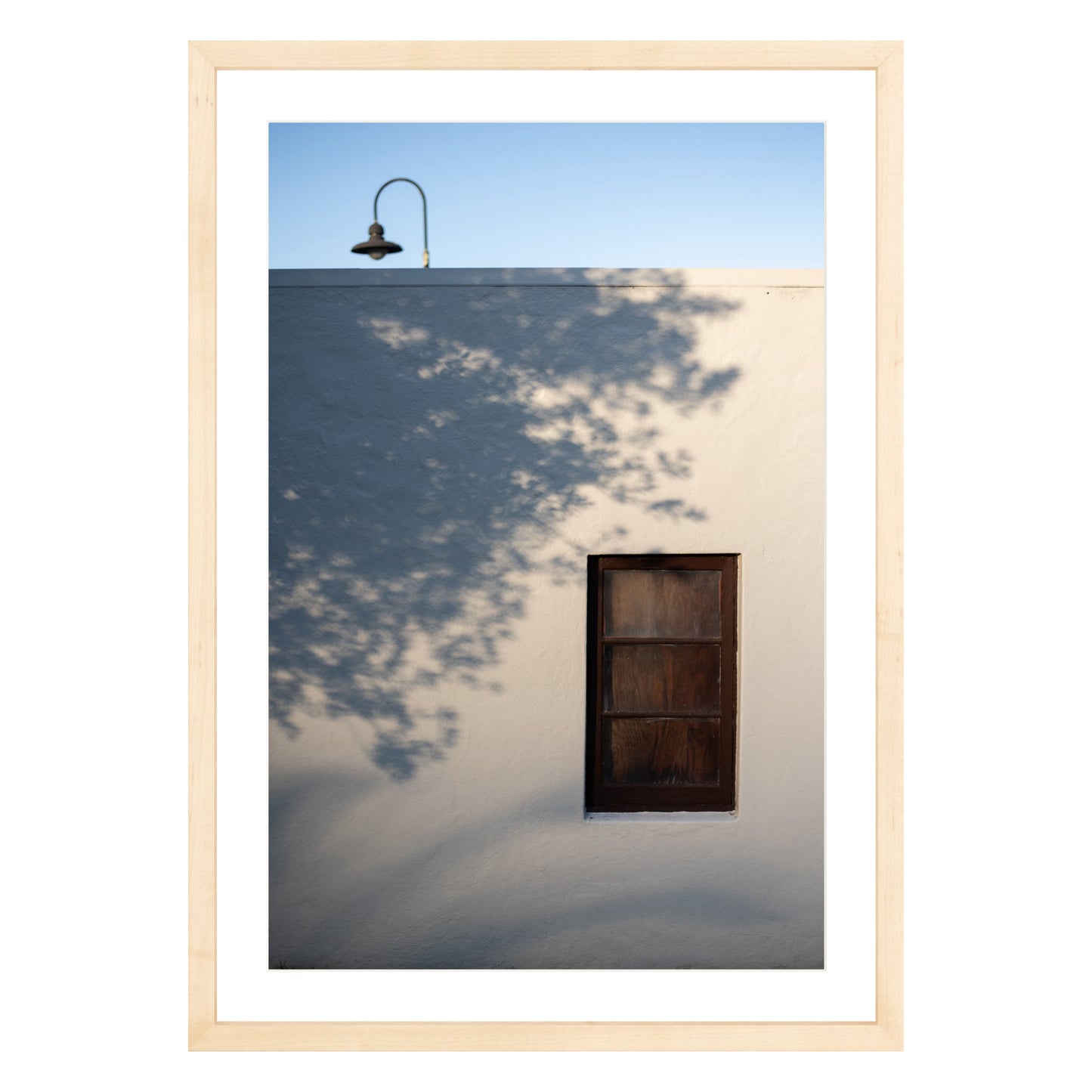 Photograph of shadows on building in San Francisco Presidio in natural wood frame with white mat
