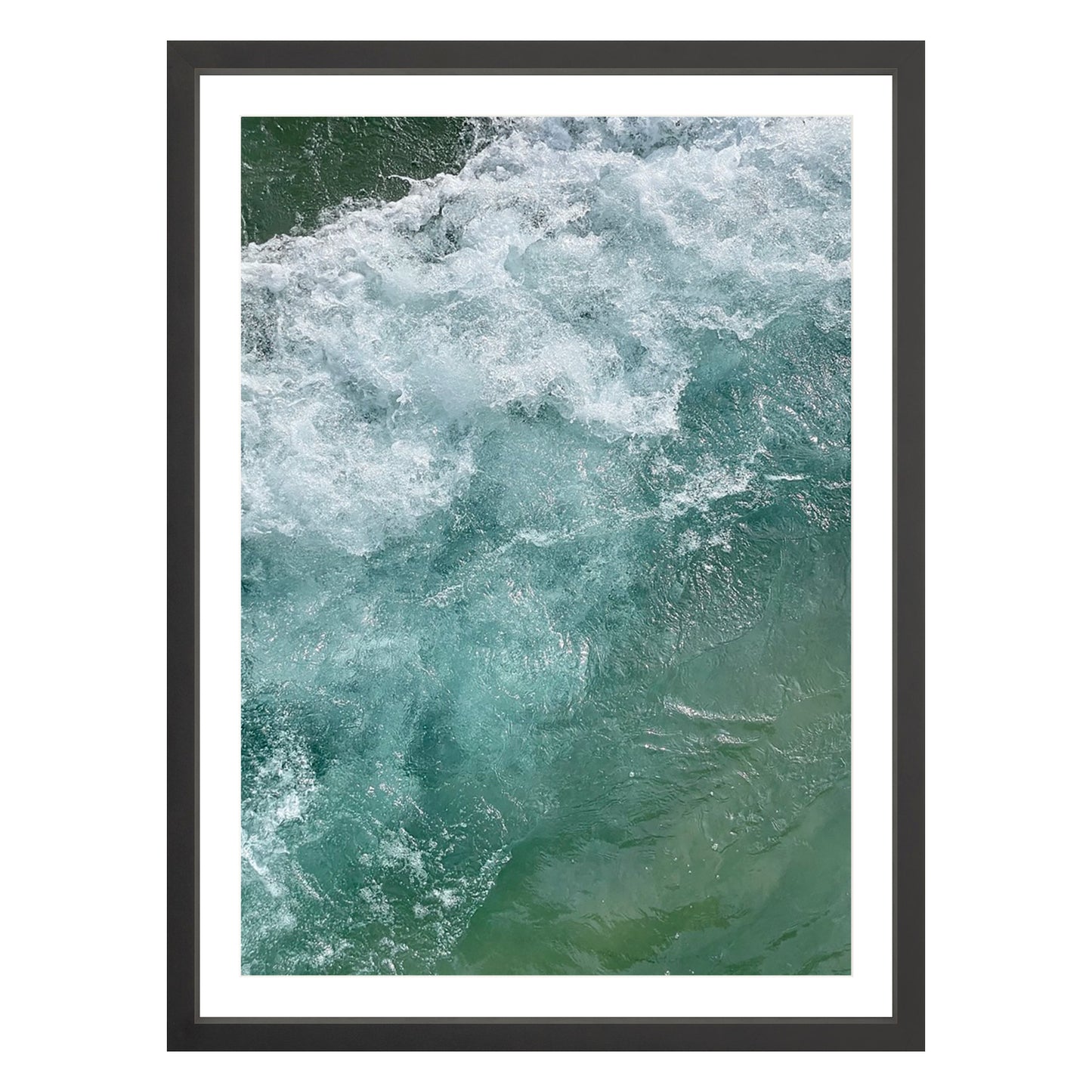 Photograph of ocean waves in Carmel California framed in black with white mat