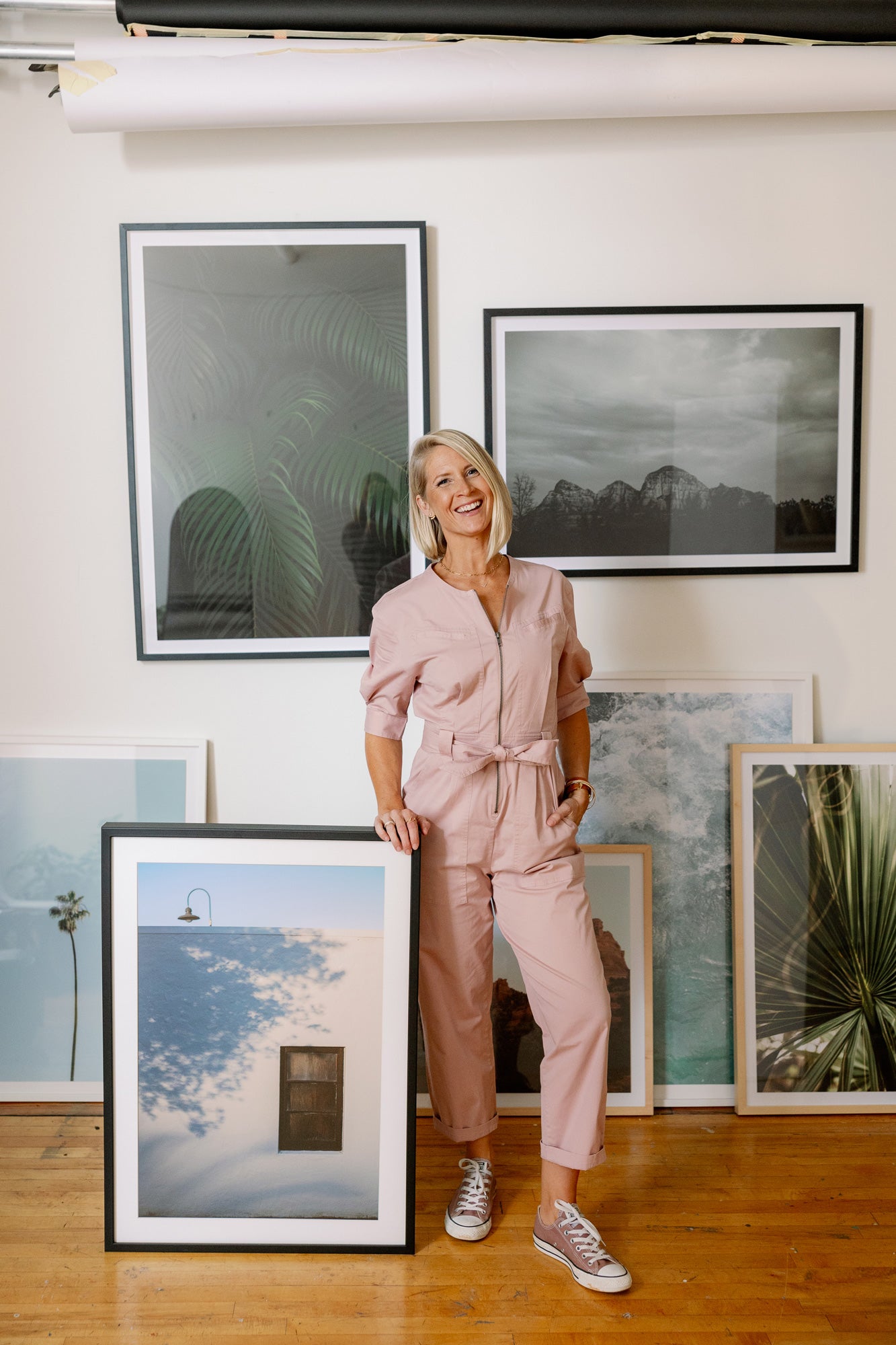 Amanda Anderson in her photography studio with framed prints