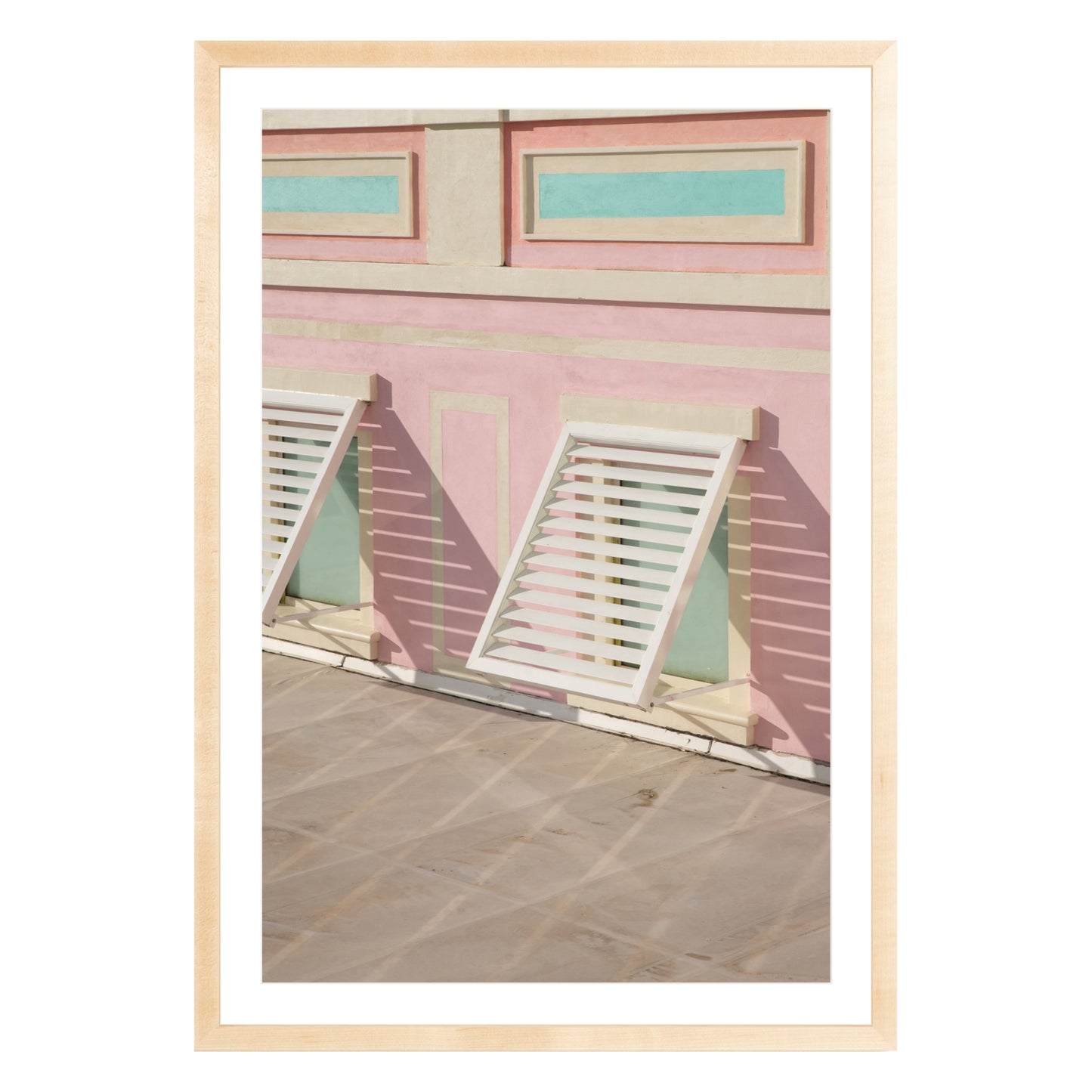 Photograph of colorful geometric building with open window shades in Baha Mar, Bahamas framed in natural wood with white mat
