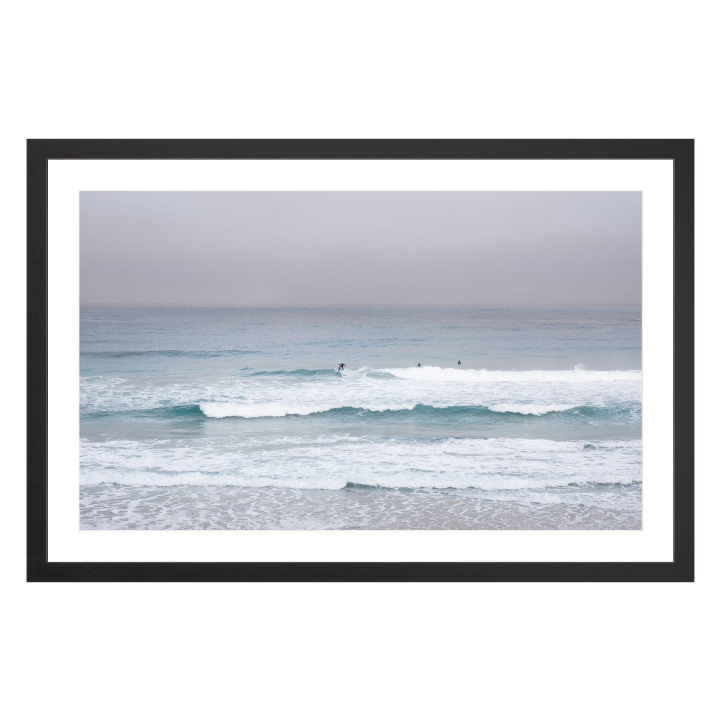 Photograph of surfers on Carmel coast, California framed in black with white mat