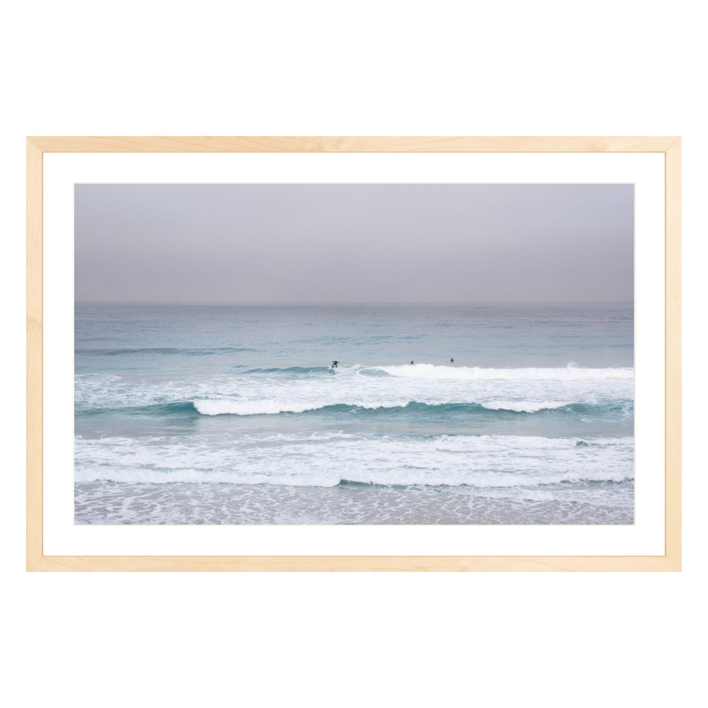 Photograph of surfers on Carmel coast, California framed in natural wood with white mat