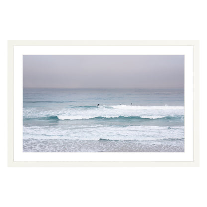 Photograph of surfers on Carmel coast, California framed in white with white mat