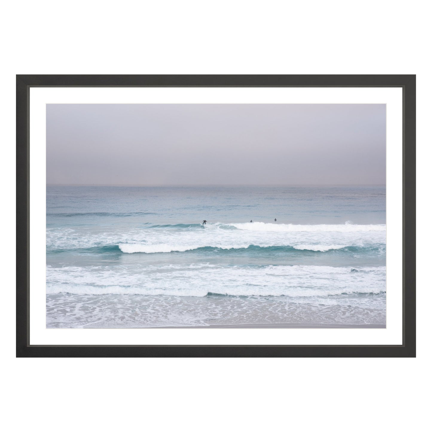 Photograph of surfers on Carmel coast, California framed in black with white mat