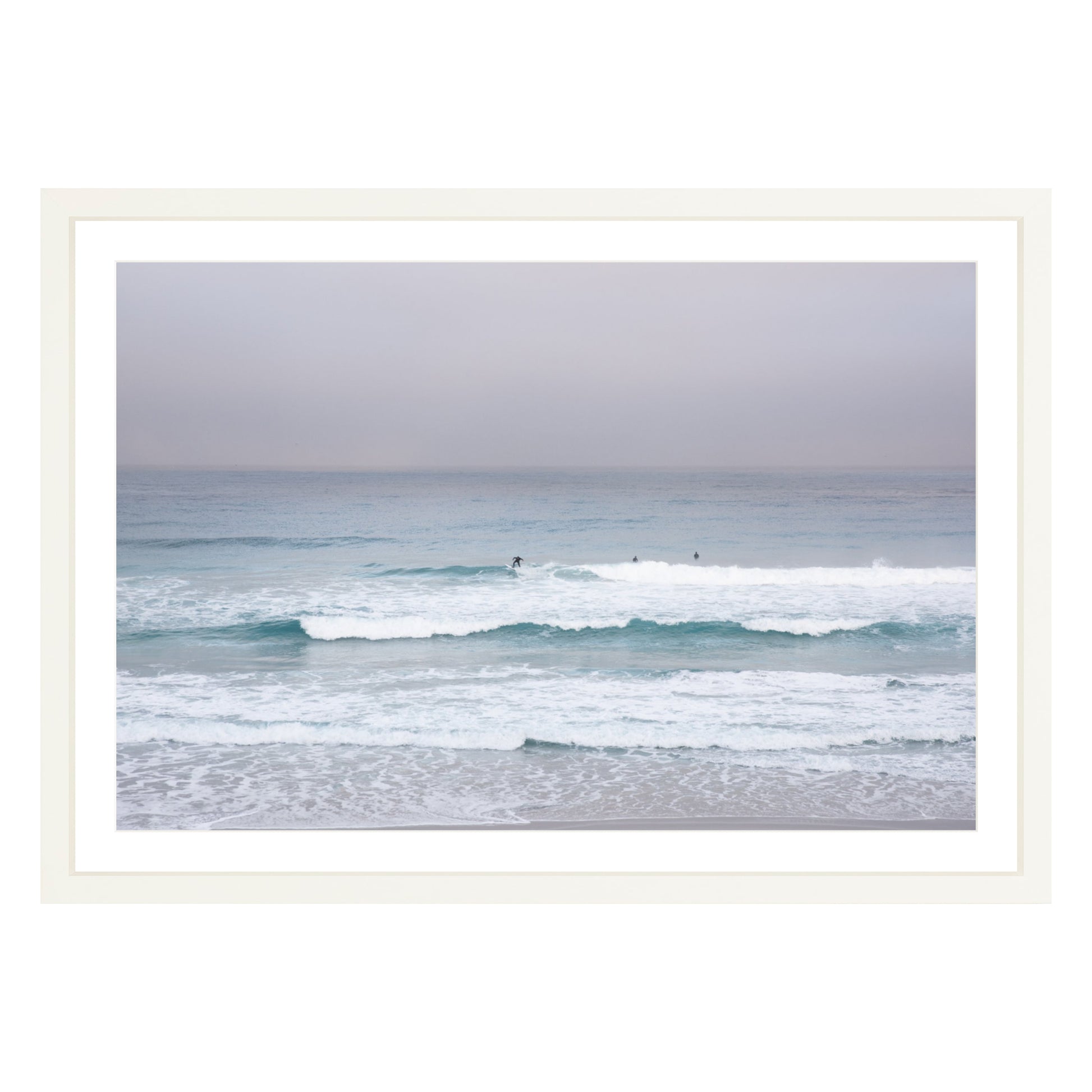 Photograph of surfers on Carmel coast, California framed in white with white mat