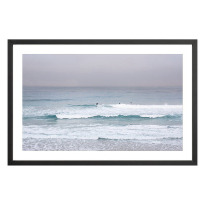 Photograph of surfers on Carmel coast, California framed in black with white mat