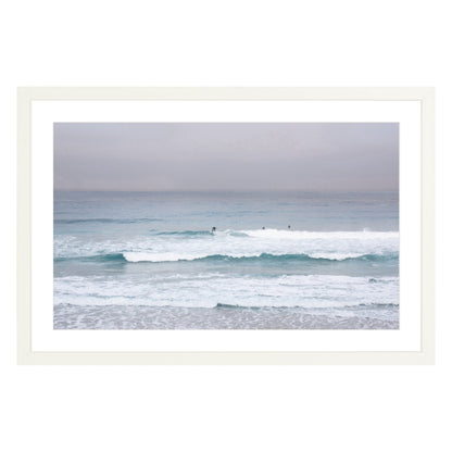 Photograph of surfers on Carmel coast, California framed in white with white mat
