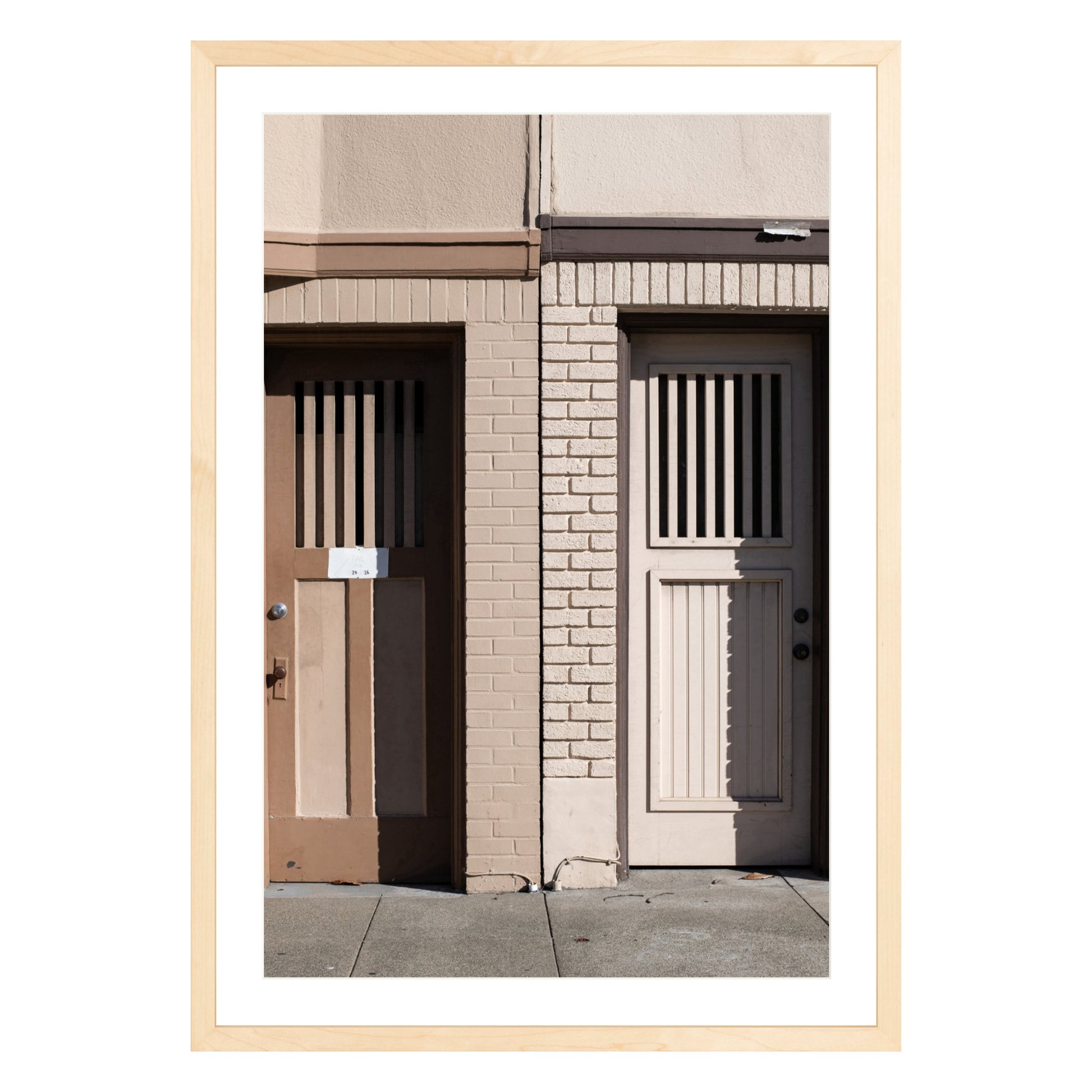 Photograph of two doors in San Francisco framed in natural wood with white mat