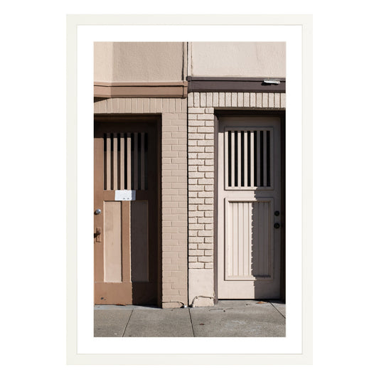 Photograph of two doors in San Francisco framed in white with white mat