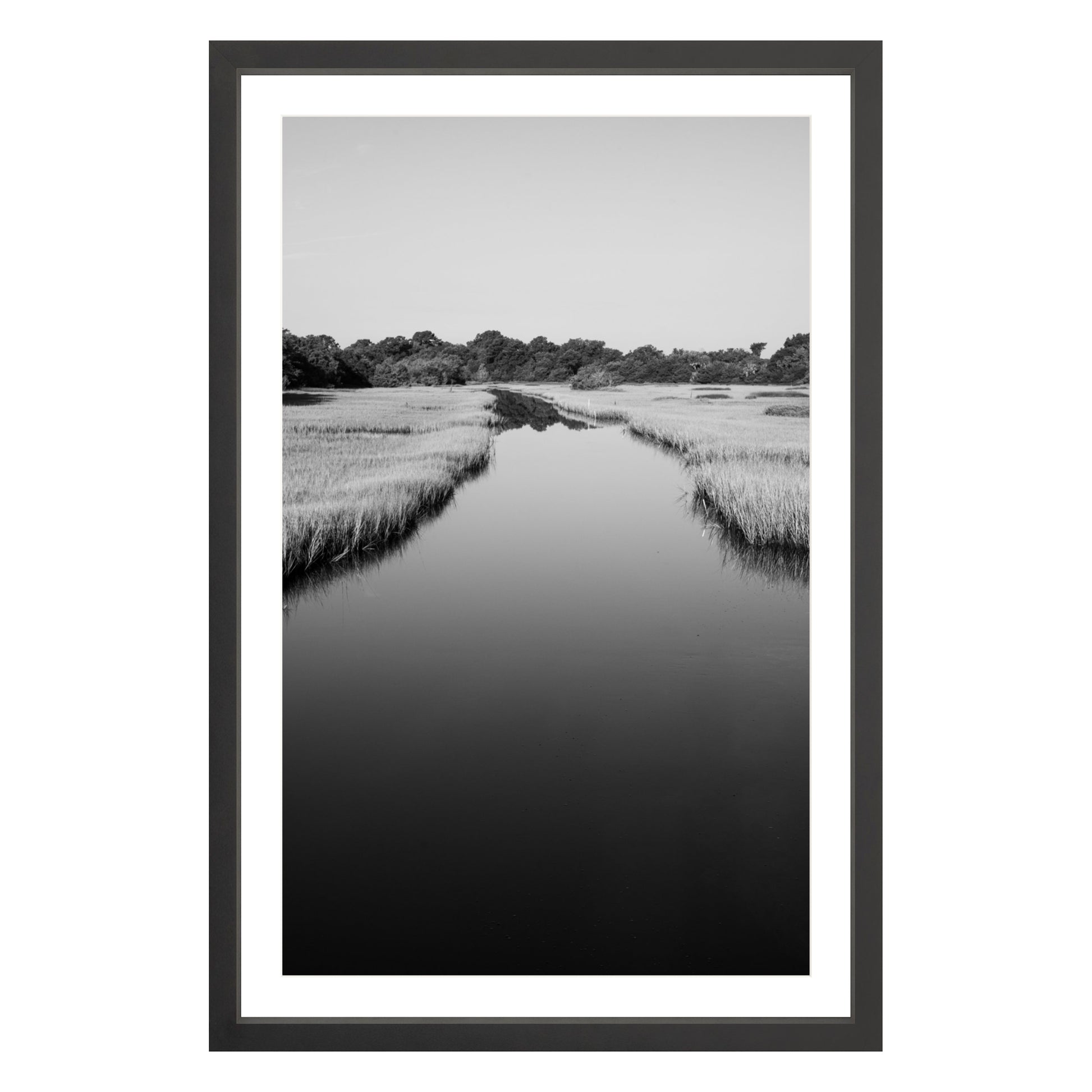 Black and white photograph of a marsh stream on Kiawah Island, South Carolina framed in black with white mat