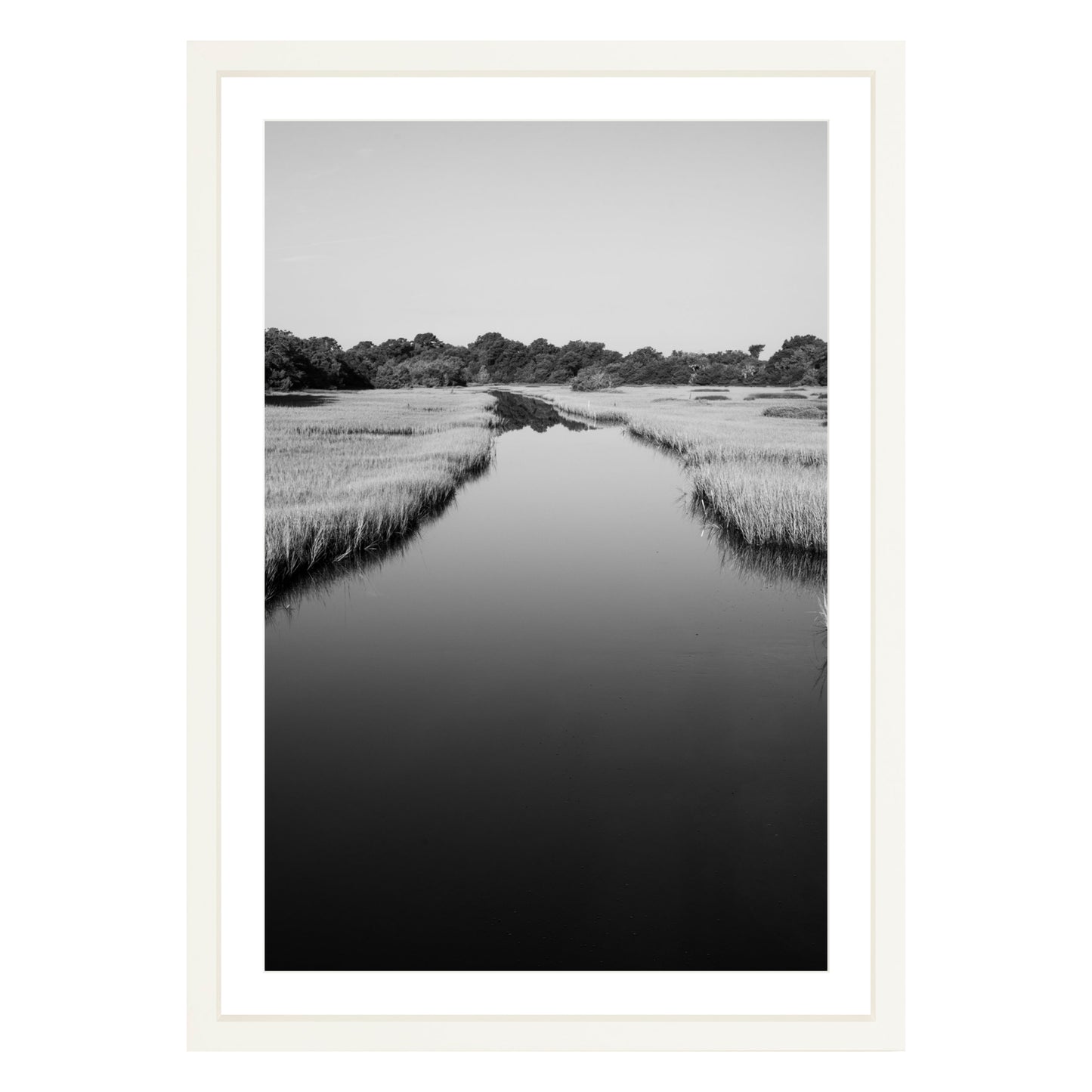 Black and white photograph of a marsh stream on Kiawah Island, South Carolina framed in white with white mat