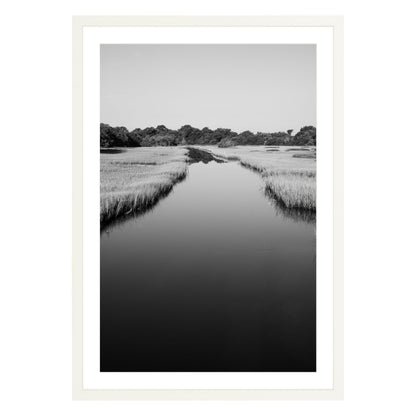 Black and white photograph of a marsh stream on Kiawah Island, South Carolina framed in white with white mat