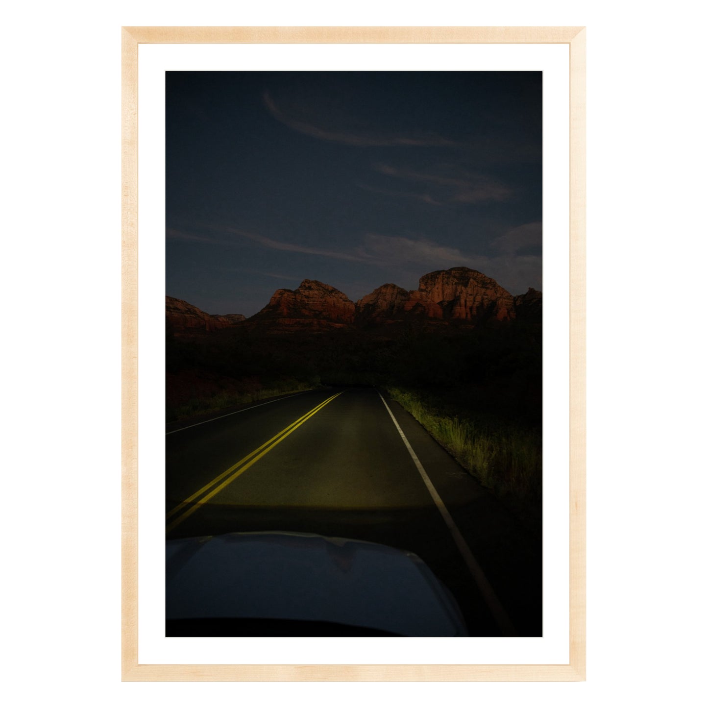Photograph of a highway and mountains at night in Sedona Arizona framed in natural wood with white mat