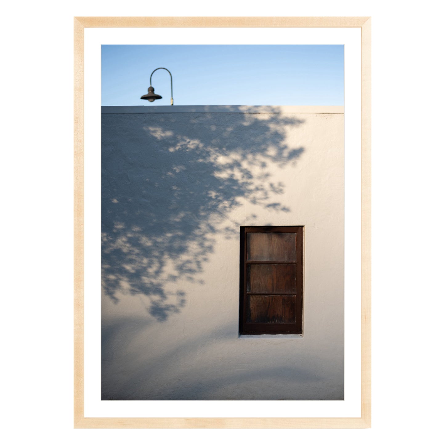Photograph of shadows on building in San Francisco Presidio in natural wood frame with white mat