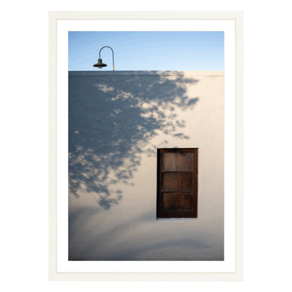 Photograph of shadows on building in San Francisco Presidio in white frame with white mat