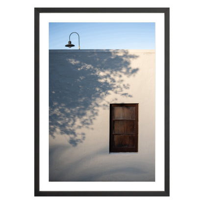 Photograph of shadows on building in San Francisco Presidio in black frame with white mat