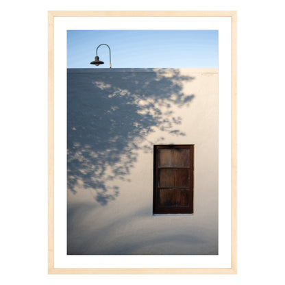 Photograph of shadows on building in San Francisco Presidio in natural wood frame with white mat