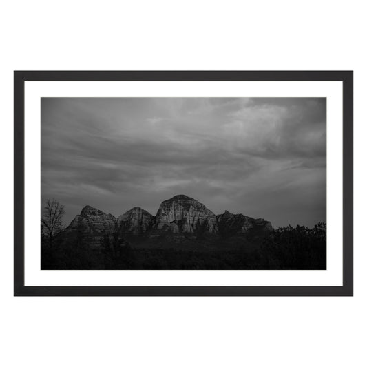 Black and white photograph of mountains in Sedona Arizona at night in a black frame with white mat
