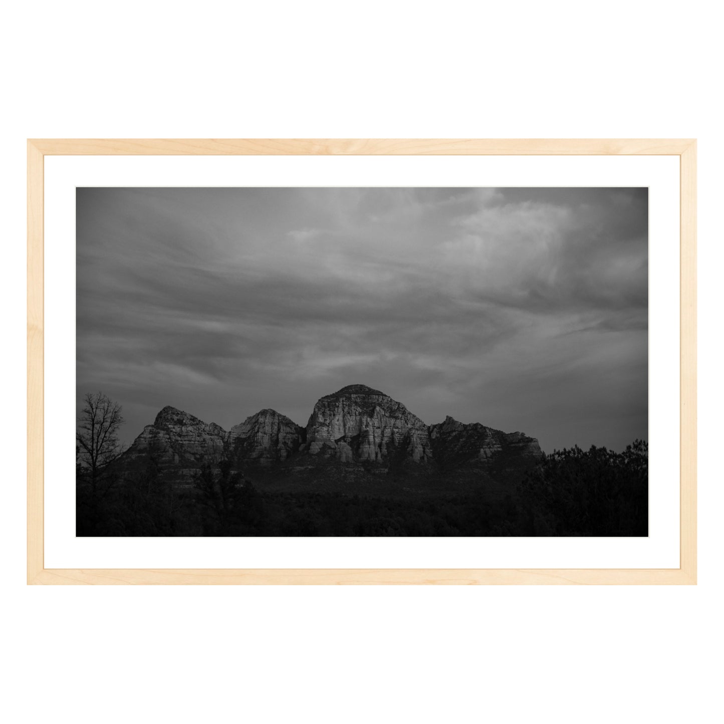 Black and white photograph of mountains in Sedona Arizona at night in a natural wood frame with white mat