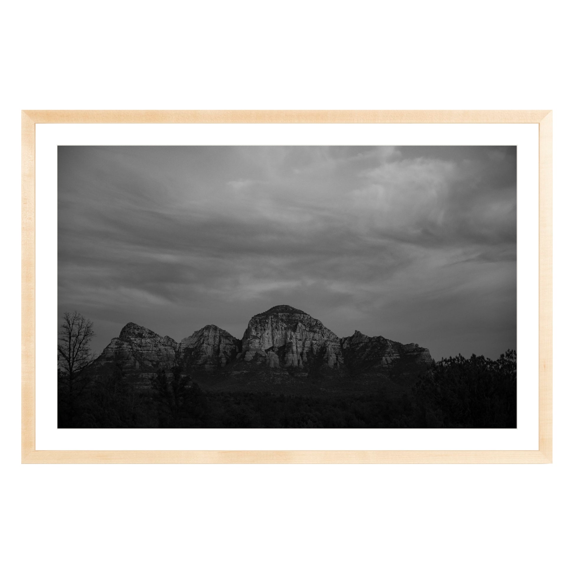 Black and white photograph of mountains in Sedona Arizona at night in a natural wood frame with white mat