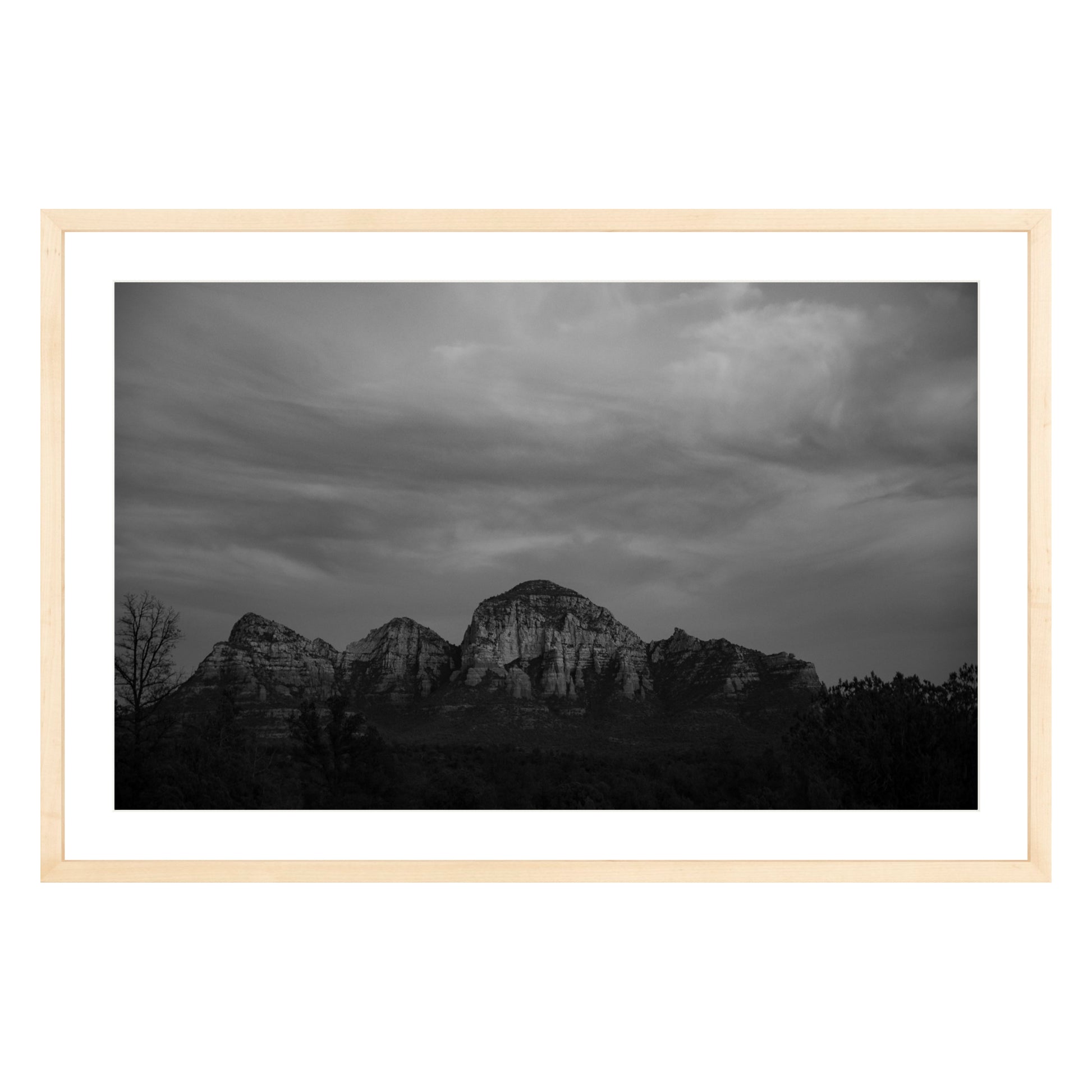 Black and white photograph of mountains in Sedona Arizona at night in a natural wood frame with white mat