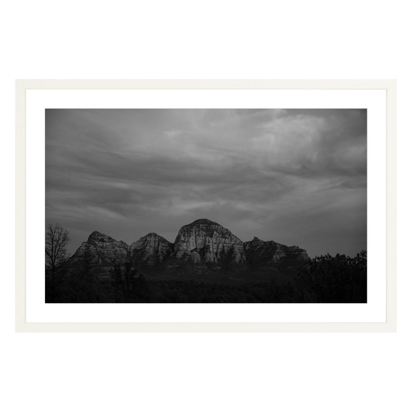 Black and white photograph of mountains in Sedona Arizona at night in a white frame with white mat