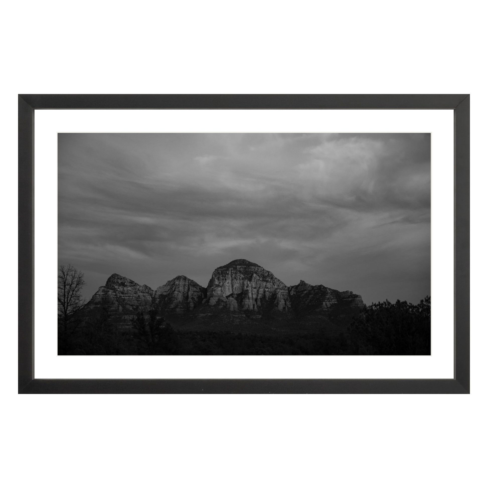 Black and white photograph of mountains in Sedona Arizona at night in a black frame with white mat
