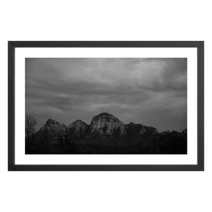 Black and white photograph of mountains in Sedona Arizona at night in a black frame with white mat