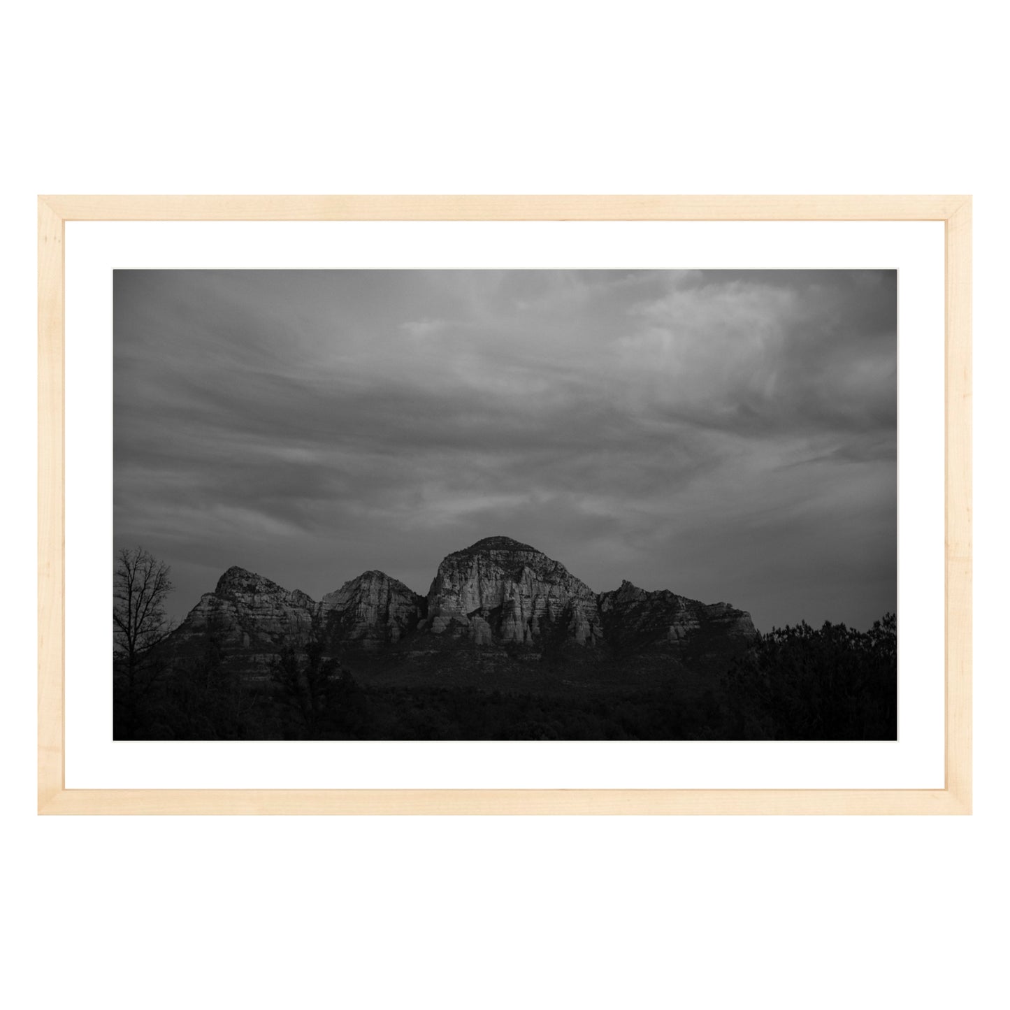 Black and white photograph of mountains in Sedona Arizona at night in a natural wood frame with white mat