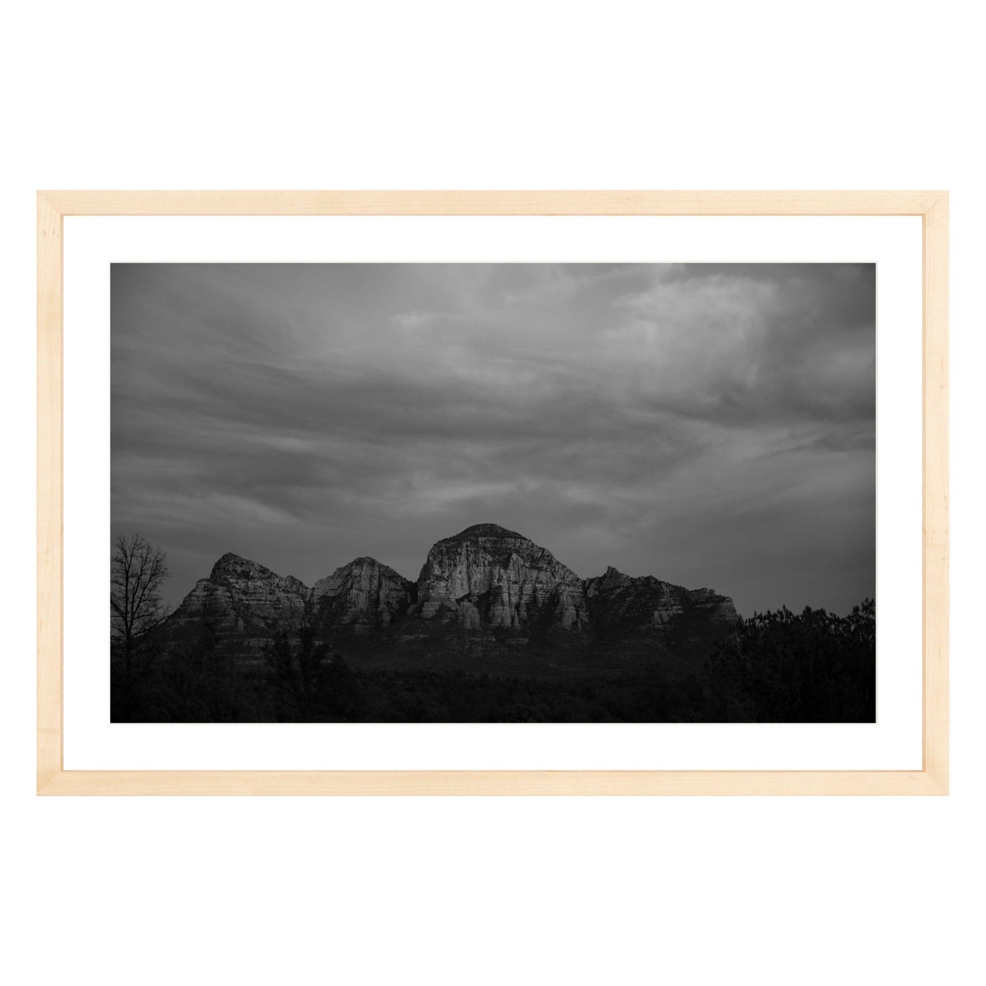 Black and white photograph of mountains in Sedona Arizona at night in a natural wood frame with white mat