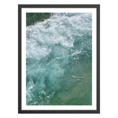 Photograph of ocean waves in Carmel California framed in black with white mat